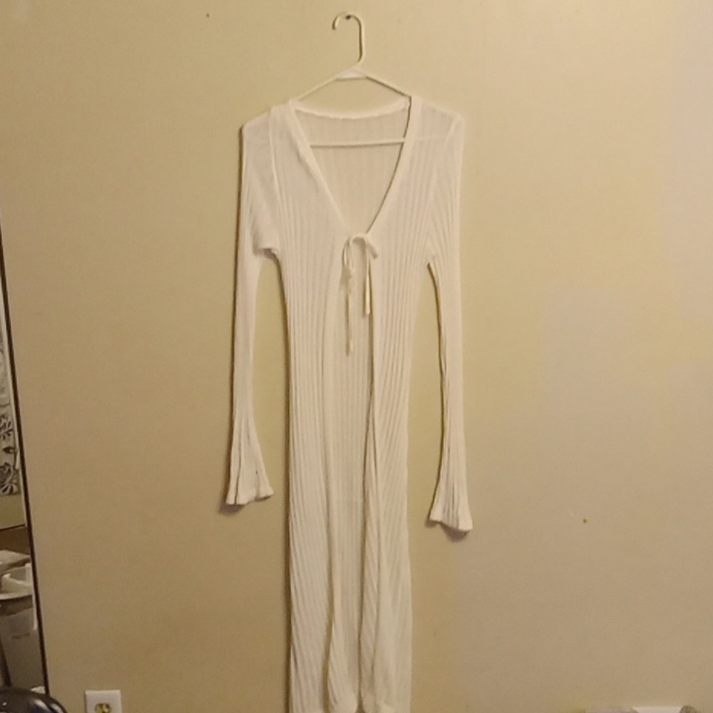 Long sleeve white cover-all with one tie.